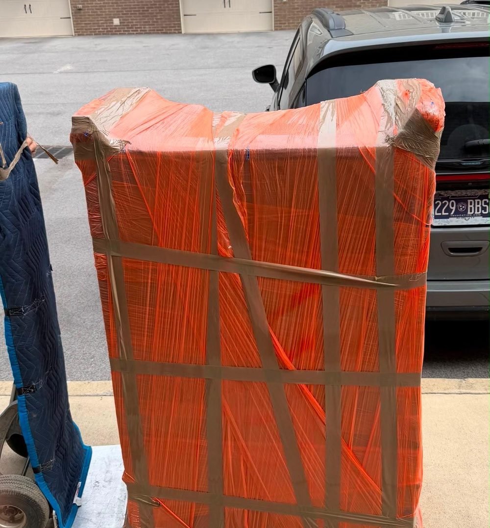 Dresser fully shrink-wrapped and padded before loading